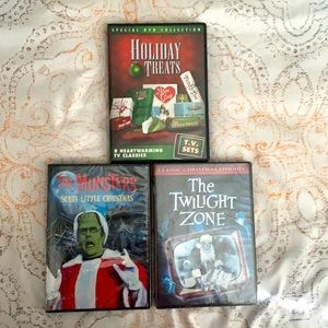 Three DVDs of holiday movies.